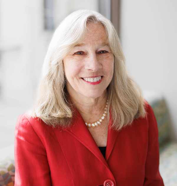 Leanne Berge wearing a red blazer and shoulder length light hair
